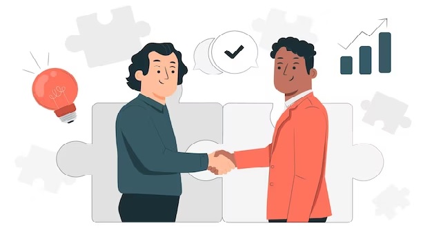 El ele sıkışarak iş birliği yapan iki insan